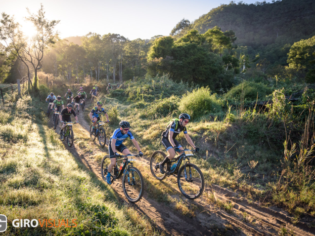 Riders of the Convict 100 marathon, quietly roll thru the early stages of the day, waiting to see who will start the racing.